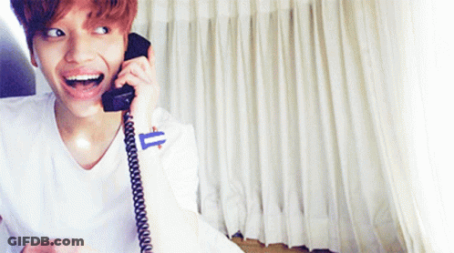 Smiling Young Man Talking On Phone GIF