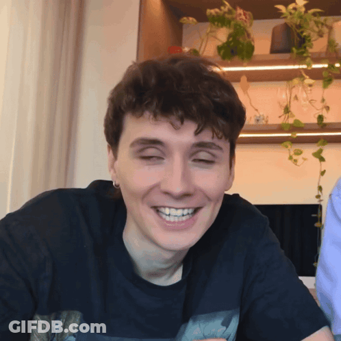 Smiling Young Man With Eyes Closed Black Shirt GIF