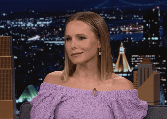 Smirking Kristen Bell Check Watch GIF