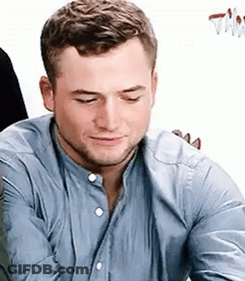 Smitten Flirty Taron Egerton GIF