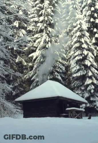 Smoke From Chimney Of Snow Covered Cabin GIF