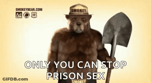Smokey The Bear Is Holding A Shovel And Wearing A Fireman 'S Hat . GIF