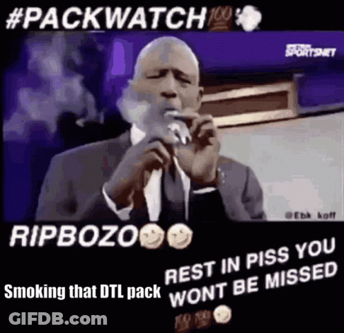 Smoking Man In Suit Talking Into Microphone GIF