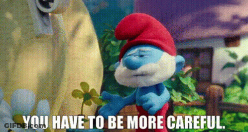 Smurf Holding Flower Says You Have To Be More Careful GIF