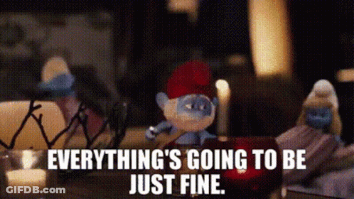 Smurf With Red Hat Sitting Beside Candle GIF