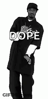 Snoop Dogg Is Dancing In A Black And White Photo While Wearing A Dope Shirt . GIF