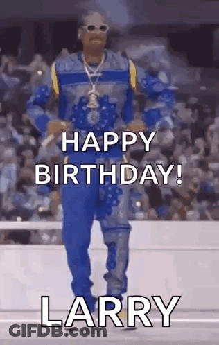 Snoop Dogg Is Dancing In Front Of A Crowd While Wearing A Blue And Yellow Outfit . GIF