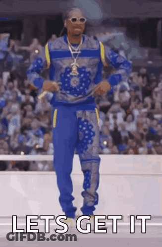 Snoop Dogg Is Dancing In Front Of A Crowd With The Words Let 'S Get It . GIF