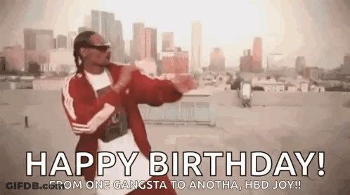 Snoop Dogg Is Dancing On A Rooftop In Front Of A City . GIF