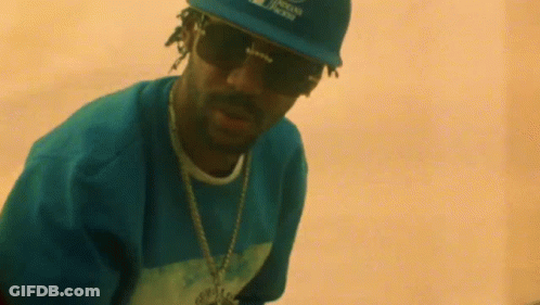 Snoop Dogg Is Wearing A Hat And Sunglasses . GIF