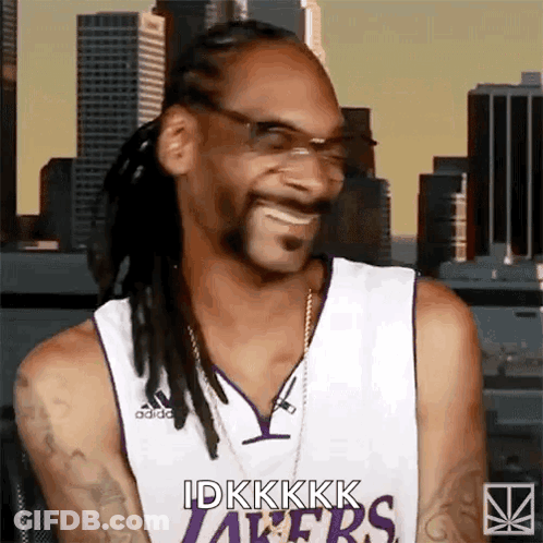 Snoop Dogg Is Wearing A Lakers Jersey While Smiling GIF