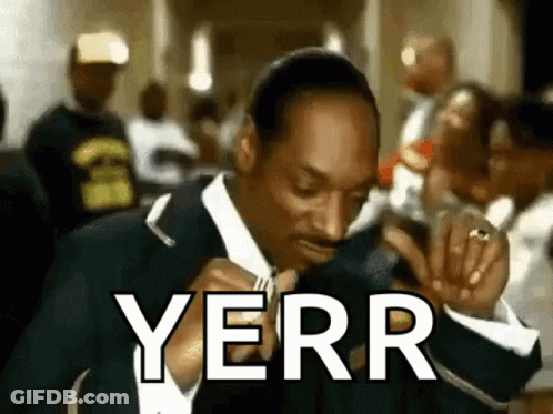Snoop Dogg Is Wearing A Suit And Tie And Smoking A Cigarette While Saying Yerry . GIF