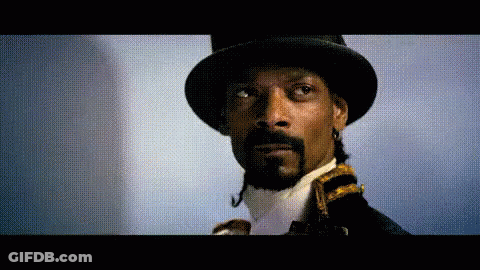 Snoop Dogg Is Wearing A Top Hat And Tie GIF