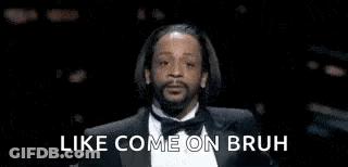 Snoop Dogg Is Wearing A Tuxedo And Smoking A Cigarette . GIF
