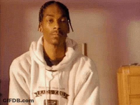 Snoop Dogg Is Wearing A White Hoodie And A White Robe . GIF