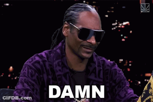Snoop Dogg Is Wearing Sunglasses And A Purple Jacket And Says " Damn " GIF