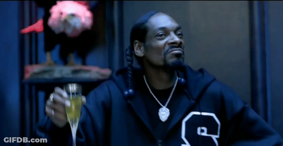 Snoop Dogg Raising Glass While Grooving GIF