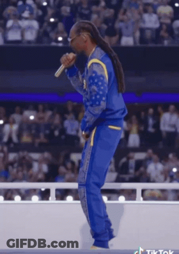 Snoop Dogg Singing Into Microphone In Front Of Crowd GIF