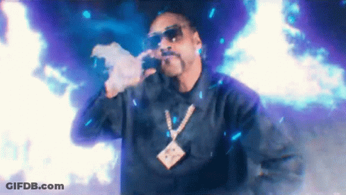 Snoop Dogg Smoking Cigarette And Singing Into Microphone GIF