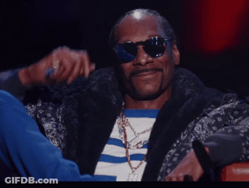 Snoop Dogg Wearing Sunglasses And A Striped Shirt GIF