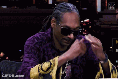 Snoop Dogg Wearing Sunglasses And Purple M Shirt GIF