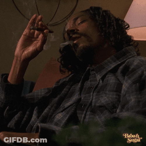 Snoop Dogg Who Is Smoking While Eyes Close GIF
