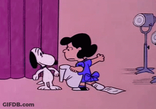 Snoopy And Lucy Kissing On Stage In Front Of Purple Curtain GIF