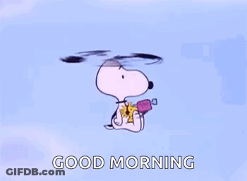 Snoopy Is Flying Through The Air While Holding A Candy And A Flower . GIF