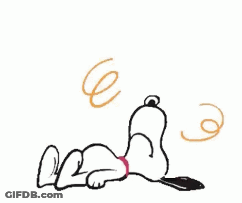 Snoopy Is Laying Down On The Floor With A Cell Phone In His Paws . GIF