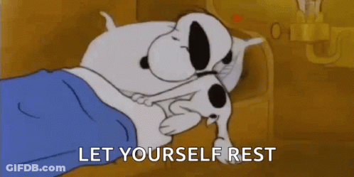 Snoopy Is Laying In Bed With A Cigarette In His Mouth And The Words `` Let Yourself Rest '' . GIF