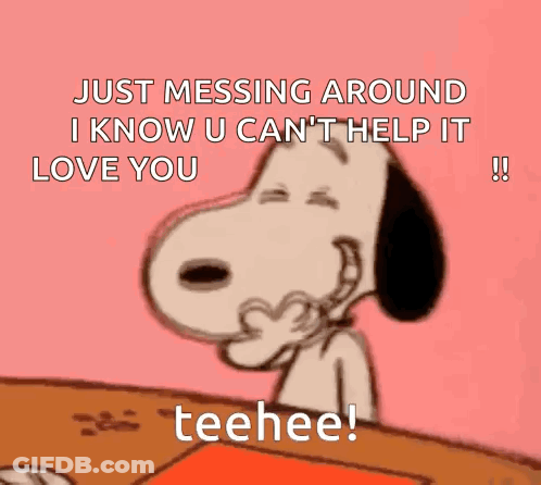 Snoopy Is Sitting At A Table And Making A Heart With His Hands And Says Just Messing Around . GIF