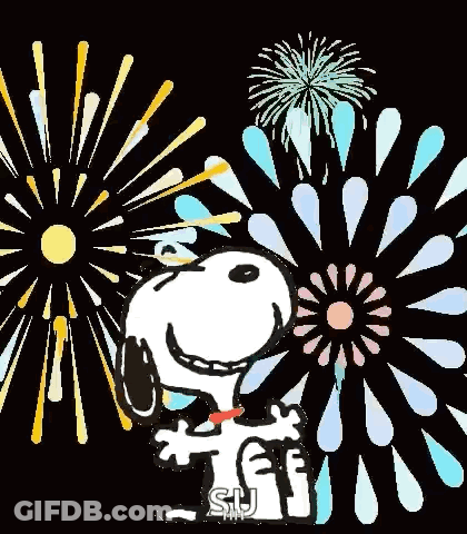 Snoopy Is Standing In Front Of A Fireworks Display And Holding A Sign That Says `` Happy New Year '' . GIF