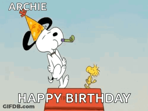 Snoopy Is Wearing A Party Hat And Blowing A Party Horn While Woodstock Is Standing On A Box . GIF