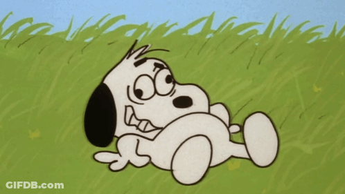 Snoopy Laying In Grass Eyes Closed GIF