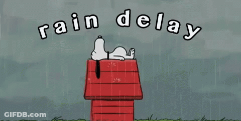 Snoopy Laying On Red Doghouse In Rain GIF