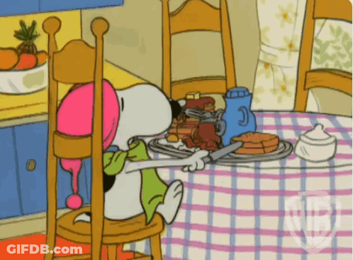 Snoopy Sitting At Table With Food GIF