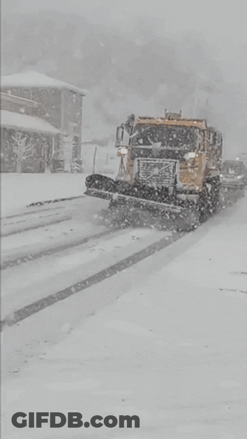 Snow Removal Vehicle Clearing Road Amid Bomb Cyclone GIF