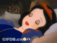 Snow White From Snow White And The Seven Dwarfs Is Sleeping In A Bed With Her Eyes Closed . GIF