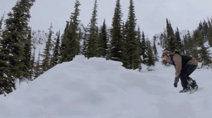 Snowboarding Spin Backflip Cliff Trick GIF