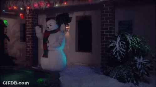 Snowman In Front Of House With Christmas Lights GIF