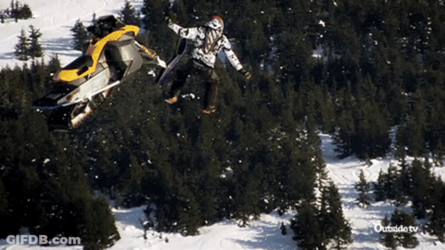 Snowmobile And Man Falling To The Ground GIF