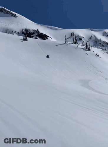 Snowmobile Going Down Snowy Hill GIF