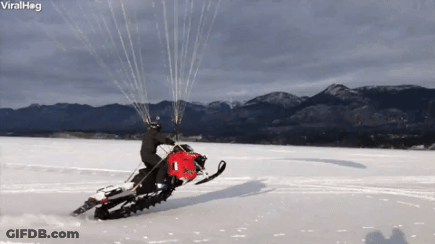 Snowmobile Running With A Parachute GIF