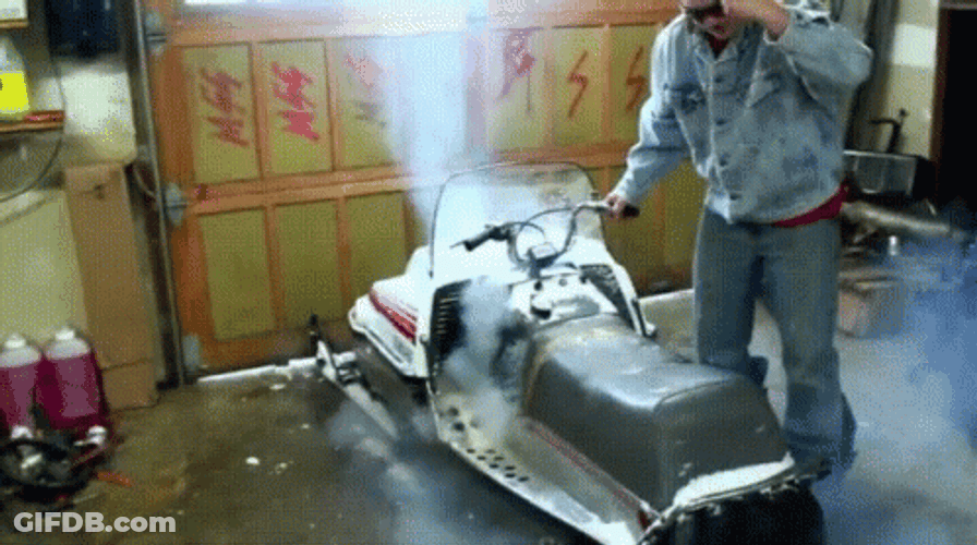 Snowmobile Smoking In A Garage GIF
