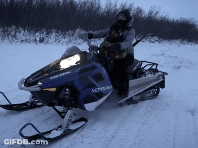 Snowmobile With A Man Taking Off GIF