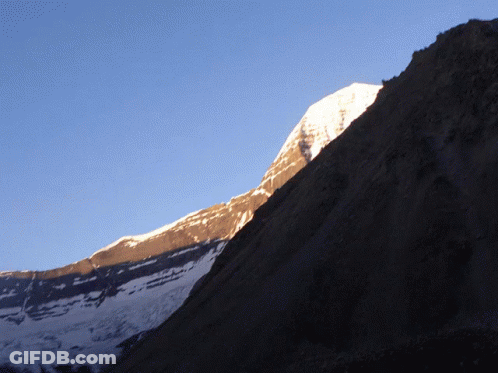 Snowy Mountain Under Blue Sky GIF