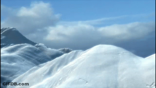 Snowy Mountain With Blue Sky And Clouds GIF
