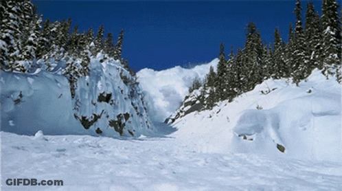 Snowy Mountain With Trees And Blue Sky GIF