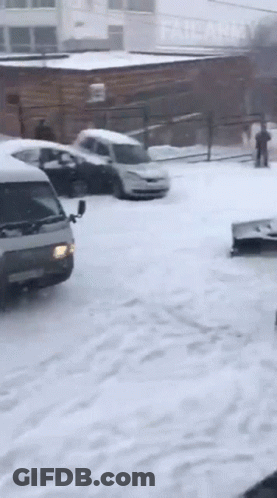 Snowy Parking Lot With Army Building GIF