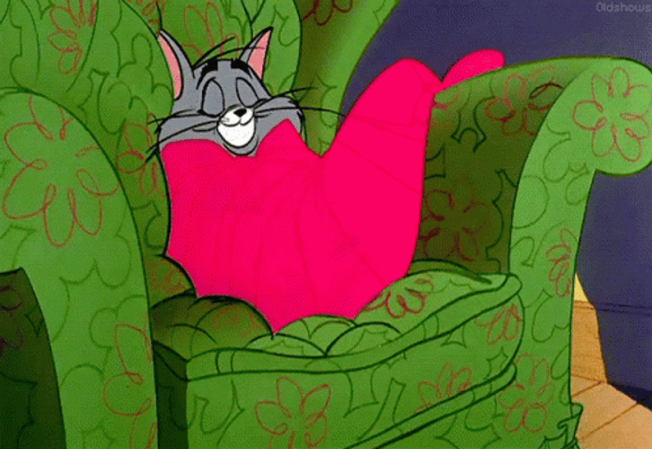 Snuggled Up Tom Cat GIF